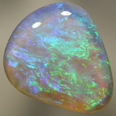 SOLID CRYSTAL OPAL Beautiful green and blues sparkle in a 3D pattern with a hue of purple through out